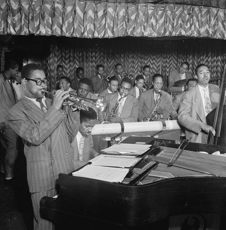 Dizzy Gillespie Orchestra – Howard Swan Johnson (first row, second from right) – Photo by © William P. Gottlieb Dizzy Gillespie Orchestra - Howard Swan Johnson (first row, second from right) - Photo by © William P. Gottlieb